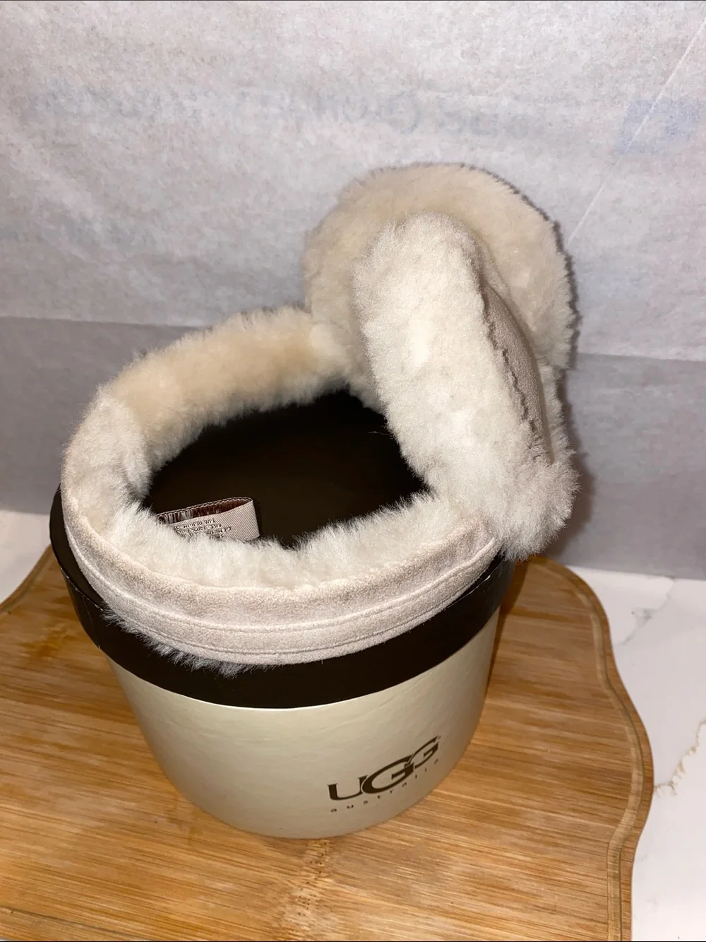 UGG Plush Shearling Ear Muffs in Light Beige with Gold Buckle
